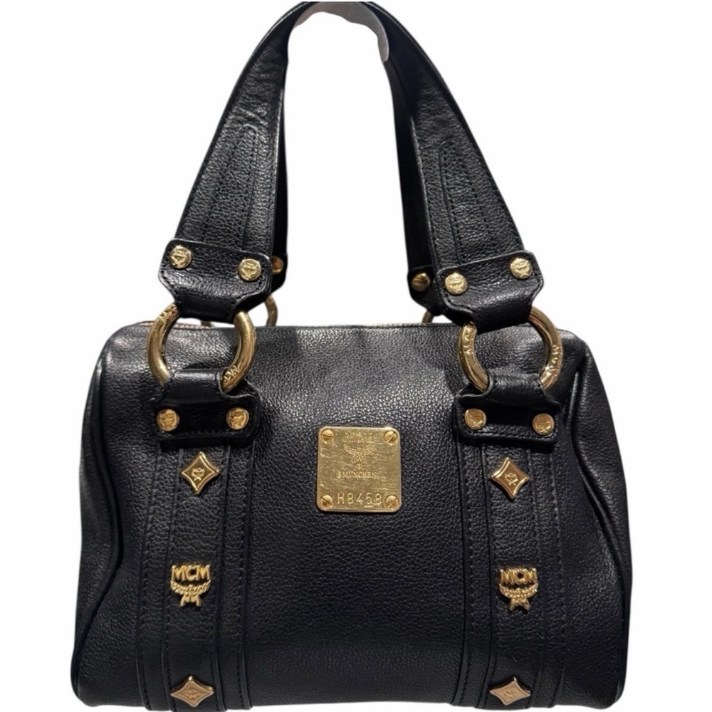 MCM mini Boston bag black with gold studded hardware. Comes with COA